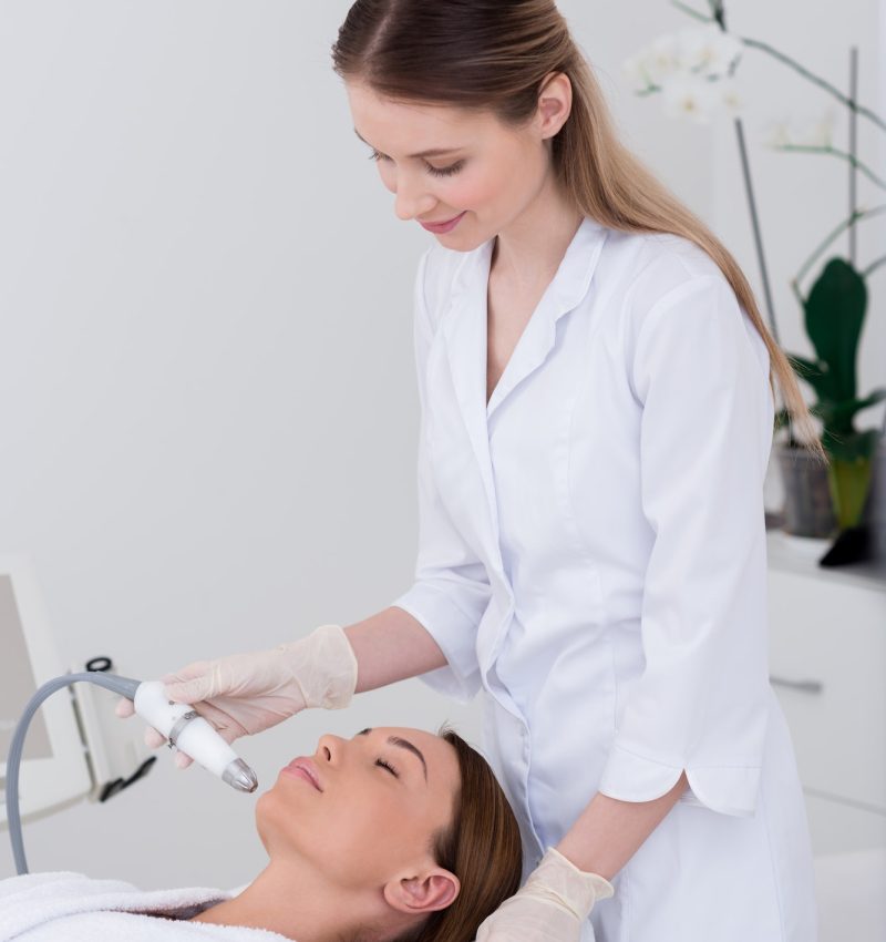 young-woman-getting-facial-treatment-in-cosmetology-salon.jpg